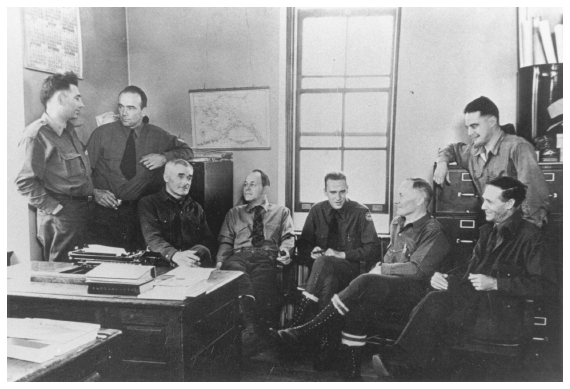 Image: Alaska Game Commission officers (from left) Sam O. White, Jack Benson, Pete McMullen, Frank Dufresne (executive director of Alaska Game Commission), Clarence Rhode, Jack O’Connor, Grenold Collins, and Frank Glaser, Fairbanks, 1939. Courtesy Jim King. Under the 1925 Alaska Game Law, the Game Commission and its officers won a reputation for competence and public service.