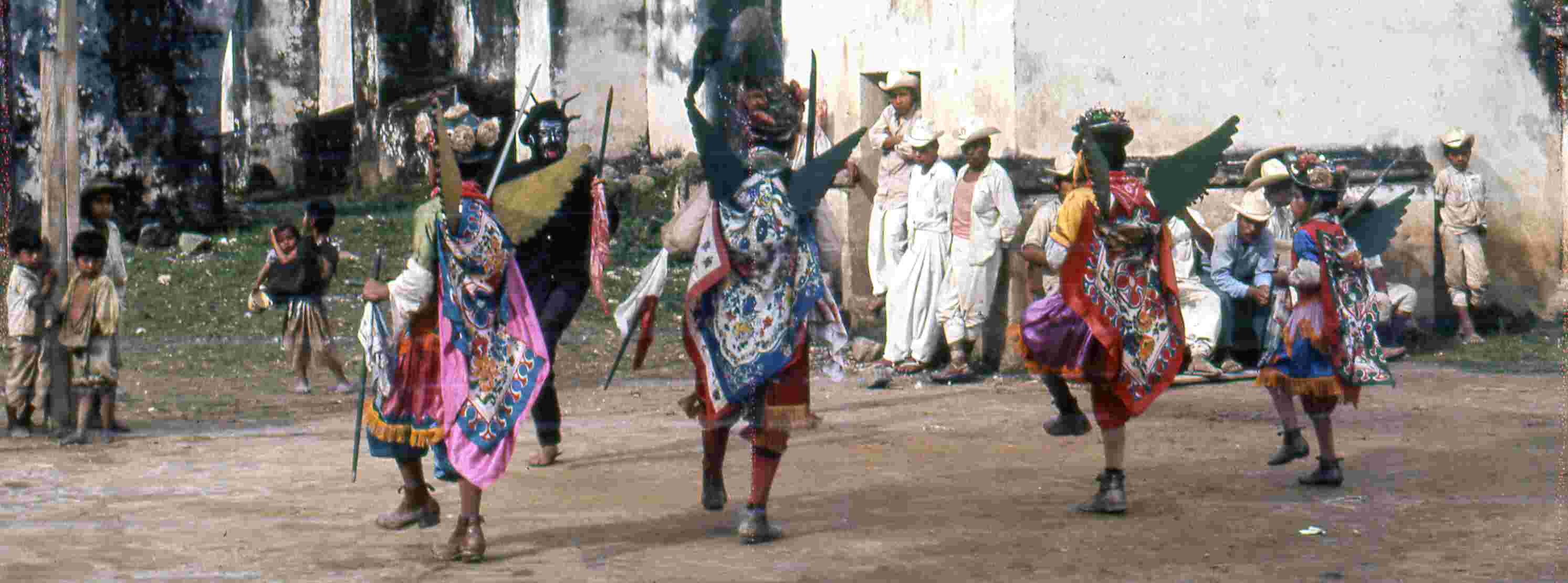 Figure 3.1. San Miguel dancers performing a morality play in front of the church on January 6, 1969.