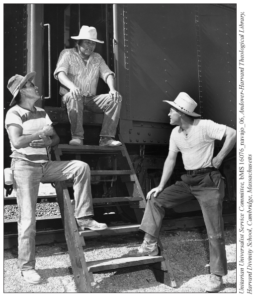 Image: A Santa Fe Railway photo of David M. Brugge and two of his students talking after a class session.