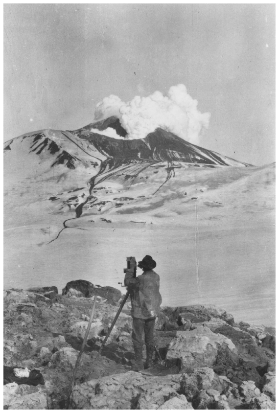 Image: W.A. Hesse filming Katmai volcano, 1913. Greely coll. PCA 66-368, Alaska State Library. The Katmai eruption drew scientific and public interest, ultimately producing a national park.