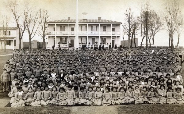 Black and white photo of children at an Indian boarding school