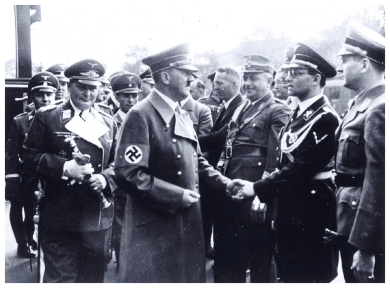 Image: Adolf Hitler shaking hands with Philipp Bouhler, chief of the Führer’s private chancellery, on October 1, 1938, one year before Hitler authorized him and Karl Brandt to implement the destruction of the mentally ill. Courtesy Bundesarchiv Koblenz