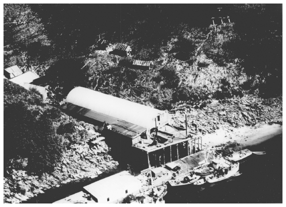 Image: Abandoned cannery, Kukak Bay, Katmai National Monument, 1951. By Lowell Sumner. Courtesy Lake Clark Katmai Studies Center. Clamming and other commercial activities threatened to revoke Katmai’s national monument status.