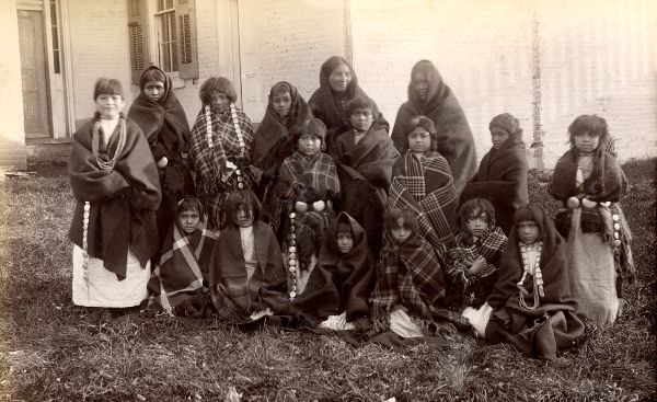 Black and white photo of Pueblo girls wearing shawls at the Carlisle Boarding School in August 1884