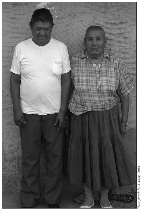 Image: Hoskie and Bessie Pinto, husband and wife healers, standing outside their home.