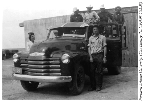 Image: Trading post owner Elijah Blair “delivering” Navajos to the railroad. Traders would often “haul” as many as twenty Navajo men over rough dirt roads in the back of open pickup trucks to railroad staging points tens or hundreds of miles away from their homes.